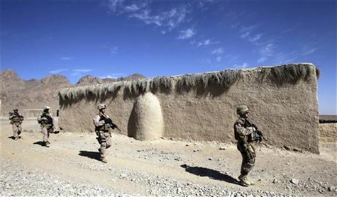 U.S. Marines of Police Advisory Team Now Zad, 2nd Battalion, 7th Marines Regiment patrol a village near a police station in Now Zad district U.S. Marines of Police Advisory Team Now Zad, 2nd Battalion, 7th Marines Regiment patrol a village near a police station in Now Zad district