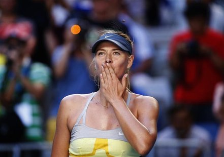 Maria Sharapova of Russia blows kisses to the crowd after defeating Misaki Doi of Japan during their women's singles match at the Australian Maria Sharapova of Russia blows kisses to the crowd after defeating Misaki Doi of Japan during their women's singles match at the Australian