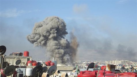 Smoke rises after what activists said were missiles fired by a Syrian Air Force fighter jet loyal to President Bashar al-Assad in Daraya in Smoke rises after what activists said were missiles fired by a Syrian Air Force fighter jet loyal to President Bashar al-Assad in Daraya in