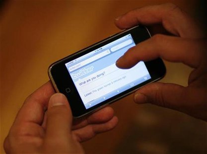 A Twitter page is displayed on an Apple iPhone in Los Angeles October 13, 2009. REUTERS/Mario Anzuoni A Twitter page is displayed on an Apple iPhone in Los Angeles October 13, 2009. REUTERS/Mario Anzuoni