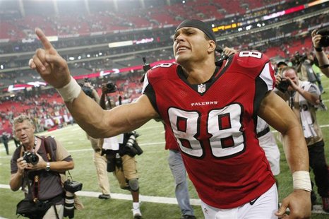 Atlanta Falcons tight end Tony Gonzalez celebrates as he leaves the field after the Falcons defeated the Seattle Seahawks in their NFL NFC D Atlanta Falcons tight end Tony Gonzalez celebrates as he leaves the field after the Falcons defeated the Seattle Seahawks in their NFL NFC D