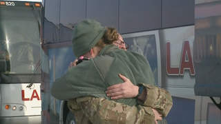 A soldier from the 1157th receives a hug shortly after arriving at the Outagamie County Regional Airport in Greenville, Friday, January 18, 2013. (courtesy of FOX 11). A soldier from the 1157th receives a hug shortly after arriving at the Outagamie County Regional Airport in Greenville, Friday, January 18, 2013. (courtesy of FOX 11).