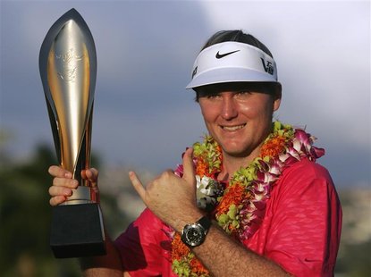 Russell Henley of the U.S. celebrates with the trophy and gestures a "Hawaiian Shaka" after winning final round of the Sony Open golf tourna Russell Henley of the U.S. celebrates with the trophy and gestures a "Hawaiian Shaka" after winning final round of the Sony Open golf tourna