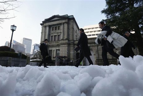 People walk past a street covered with snow in front of the Bank of Japan in Tokyo January 15, 2013. REUTERS/Kim Kyung-Hoon People walk past a street covered with snow in front of the Bank of Japan in Tokyo January 15, 2013. REUTERS/Kim Kyung-Hoon