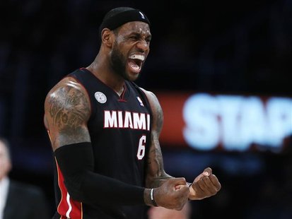 Miami Heat's LeBron James celebrates during their NBA basketball game against the Los Angeles Lakers in Los Angeles January 17, 2013. REUTER Miami Heat's LeBron James celebrates during their NBA basketball game against the Los Angeles Lakers in Los Angeles January 17, 2013. REUTER