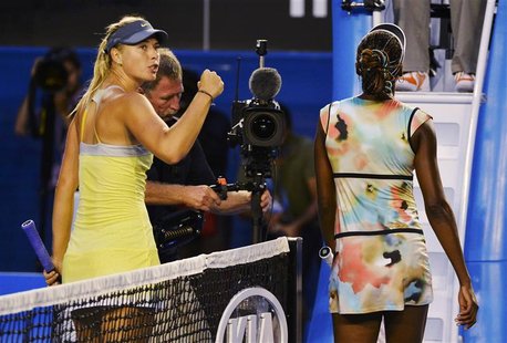 Maria Sharapova of Russia (L) celebrates defeating Venus Williams of the U.S. (R) in their women's singles match at the Australian Open tenn Maria Sharapova of Russia (L) celebrates defeating Venus Williams of the U.S. (R) in their women's singles match at the Australian Open tenn