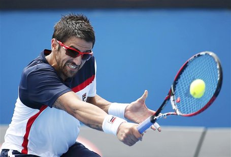 Janko Tipsarevic of Serbia hits a return to Julien Benneteau of France during their men's singles match at the Australian Open tennis tourna Janko Tipsarevic of Serbia hits a return to Julien Benneteau of France during their men's singles match at the Australian Open tennis tourna