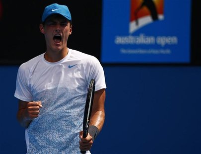 Bernard Tomic of Australia celebrates during his men's singles match against Daniel Brands of Germany at the Australian Open tennis tourname Bernard Tomic of Australia celebrates during his men's singles match against Daniel Brands of Germany at the Australian Open tennis tourname