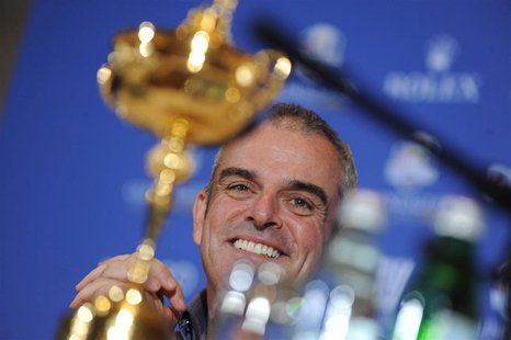 Paul McGinley of Ireland smiles near the Ryder Cup during a news conference after being named the European Ryder Cup captain at the St. Regi Paul McGinley of Ireland smiles near the Ryder Cup during a news conference after being named the European Ryder Cup captain at the St. Regi