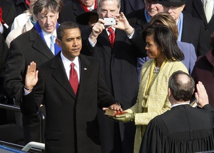 Barack Obama takes the Oath of Office as the 44th president of the United States from U.S. Chief Justice John Roberts as his wife Michelle h Barack Obama takes the Oath of Office as the 44th president of the United States from U.S. Chief Justice John Roberts as his wife Michelle h