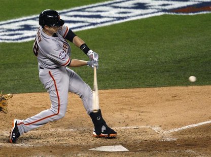 San Francisco Giants' Buster Posey hits a two-run home run against the Detroit Tigers in the sixth inning during Game 4 of the MLB World Ser San Francisco Giants' Buster Posey hits a two-run home run against the Detroit Tigers in the sixth inning during Game 4 of the MLB World Ser