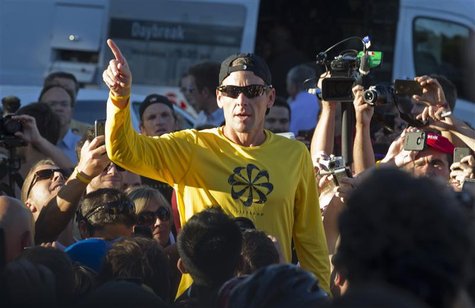 Lance Armstrong speaks to the crowd prior to a run with his fans at Mount Royal park in Montreal August 29, 2012. REUTERS/Christinne Muschi Lance Armstrong speaks to the crowd prior to a run with his fans at Mount Royal park in Montreal August 29, 2012. REUTERS/Christinne Muschi