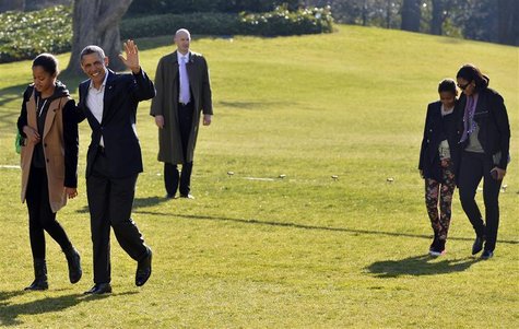 U.S. President Barack Obama (2nd L) waves to the media as he walks with daughter Malia as he is trailed by First Lady Michelle Obama and dau U.S. President Barack Obama (2nd L) waves to the media as he walks with daughter Malia as he is trailed by First Lady Michelle Obama and dau