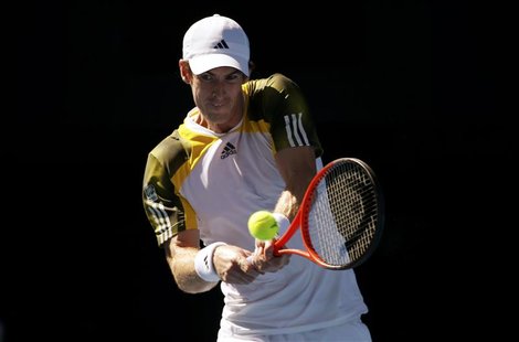 Andy Murray of Britain hits a return to Ricardas Berankis of Lithuania during their men's singles match at the Australian Open tennis tourna Andy Murray of Britain hits a return to Ricardas Berankis of Lithuania during their men's singles match at the Australian Open tennis tourna