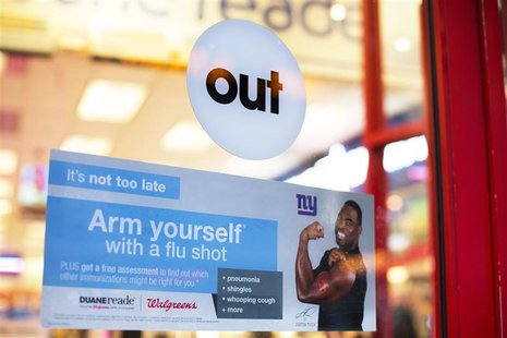 A sign advertising the availability of flu shots is taped onto a door of a Duane Reade in New York, January 14, 2013. REUTERS/Lucas Jackson A sign advertising the availability of flu shots is taped onto a door of a Duane Reade in New York, January 14, 2013. REUTERS/Lucas Jackson