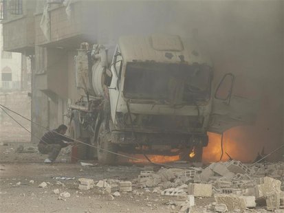 A fire burns after what activists said were missiles fired by a Syrian Air Force fighter jet loyal to President Bashar al-Assad in Daraya Ja A fire burns after what activists said were missiles fired by a Syrian Air Force fighter jet loyal to President Bashar al-Assad in Daraya Ja