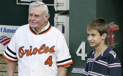 Former Baltimore Orioles manager and member of Major League Baseball's Hall of Fame, Earl Weaver stands with his grand son Jake in the dugou Former Baltimore Orioles manager and member of Major League Baseball's Hall of Fame, Earl Weaver stands with his grand son Jake in the dugou
