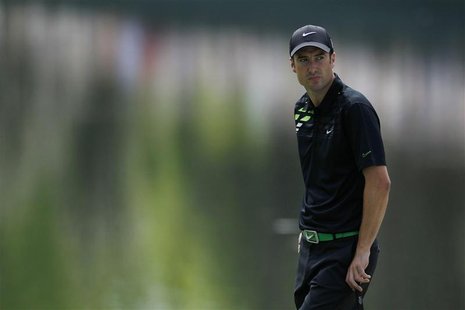 Ross Fisher of England waits to putt on the 16th green during first round play in the 2012 Masters Golf Tournament at the Augusta National G Ross Fisher of England waits to putt on the 16th green during first round play in the 2012 Masters Golf Tournament at the Augusta National G