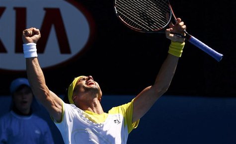 David Ferrer of Spain celebrates defeating Kei Nishikori of Japan in their men's singles match at the Australian Open tennis tournament in M David Ferrer of Spain celebrates defeating Kei Nishikori of Japan in their men's singles match at the Australian Open tennis tournament in M