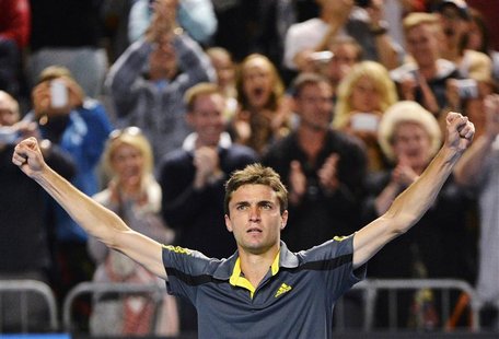 Gilles Simon of France celebrates defeating compatriot Gael Monfils in their men's singles match at the Australian Open tennis tournament in Gilles Simon of France celebrates defeating compatriot Gael Monfils in their men's singles match at the Australian Open tennis tournament in