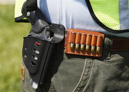 A handgun, holster and cartridges are seen on a participant at the "Restore the Constitution Rally 4-19-2010" at Gravelly Point Park, Virgin A handgun, holster and cartridges are seen on a participant at the "Restore the Constitution Rally 4-19-2010" at Gravelly Point Park, Virgin