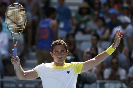 Nicolas Almagro of Spain acknowledges the crowd after progressing to the quarter-finals after Janko Tipsarevic of Serbia retired hurt in the Nicolas Almagro of Spain acknowledges the crowd after progressing to the quarter-finals after Janko Tipsarevic of Serbia retired hurt in the
