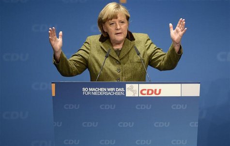 German Chancellor Angela Merkel delivers her speech during an election campaign with Lower Saxony's Christian Democratic state governor Davi German Chancellor Angela Merkel delivers her speech during an election campaign with Lower Saxony's Christian Democratic state governor Davi