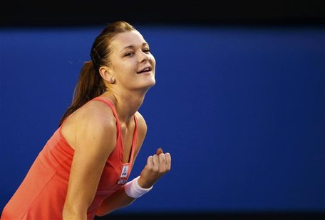 Agnieszka Radwanska of Poland celebrates defeating Ana Ivanovic of Serbia during their women's singles match at the Australian Open tennis t Agnieszka Radwanska of Poland celebrates defeating Ana Ivanovic of Serbia during their women's singles match at the Australian Open tennis t