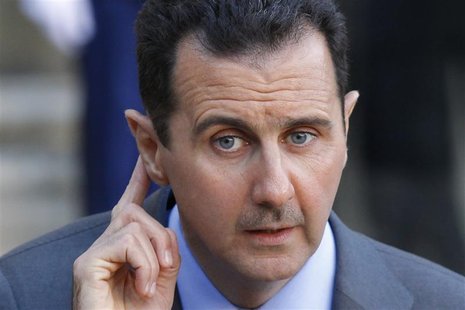 Syria's President Bashar al-Assad answers journalists after a meeting at the Elysee Palace in Paris, December 9, 2010. REUTERS/Benoit Tessie Syria's President Bashar al-Assad answers journalists after a meeting at the Elysee Palace in Paris, December 9, 2010. REUTERS/Benoit Tessie