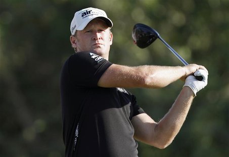 Jamie Donaldson of Wales watches his shot from the 16th tee during the fourth and final round of the Abu Dhabi Golf Championship at the Abu Jamie Donaldson of Wales watches his shot from the 16th tee during the fourth and final round of the Abu Dhabi Golf Championship at the Abu