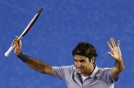 Roger Federer of Switzerland celebrates defeating Bernard Tomic of Australia in their men's singles match at the Australian Open tennis tour Roger Federer of Switzerland celebrates defeating Bernard Tomic of Australia in their men's singles match at the Australian Open tennis tour