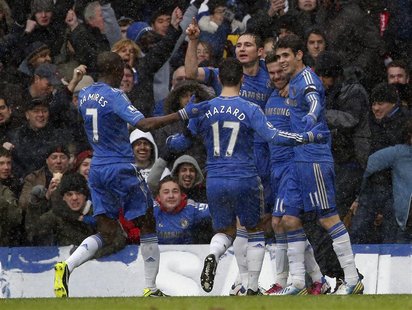 Chelsea's Juan Mata (2nd R) celebrates his goal against Arsenal during their English Premier League soccer match at Stamford Bridge in Londo Chelsea's Juan Mata (2nd R) celebrates his goal against Arsenal during their English Premier League soccer match at Stamford Bridge in Londo