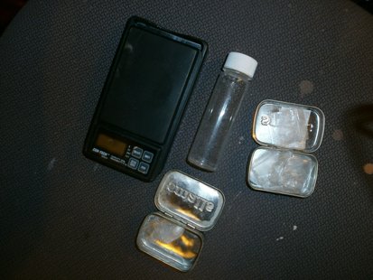 Small amounts of meth packaged for sale, with scale. Small amounts of meth packaged for sale, with scale.