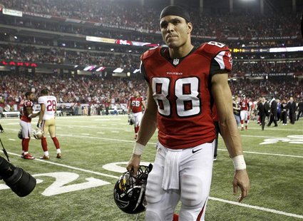 Atlanta Falcons tight end Tony Gonzalez walks off the field after his team was defeated by the San Francisco 49ers in the NFL NFC Championsh Atlanta Falcons tight end Tony Gonzalez walks off the field after his team was defeated by the San Francisco 49ers in the NFL NFC Championsh