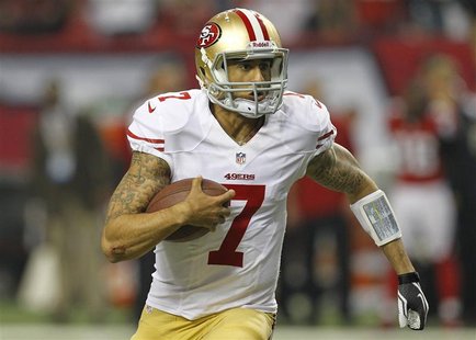San Francisco 49ers quarterback Colin Kaepernick scrambles against the Atlanta Falcons during the third quarter in the NFL NFC Championship San Francisco 49ers quarterback Colin Kaepernick scrambles against the Atlanta Falcons during the third quarter in the NFL NFC Championship