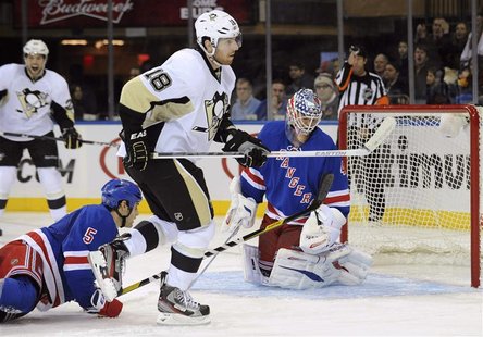 New York Rangers goaltender Martin Biron (R) reacts after Pittsburgh Penguins winger James Neal (18) scored during the third period of their New York Rangers goaltender Martin Biron (R) reacts after Pittsburgh Penguins winger James Neal (18) scored during the third period of their