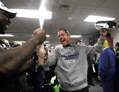 Baltimore Ravens head coach John Harbaugh celebrates in the dressing room after his team defeated the New England Patriots in the NFL AFC Ch Baltimore Ravens head coach John Harbaugh celebrates in the dressing room after his team defeated the New England Patriots in the NFL AFC Ch