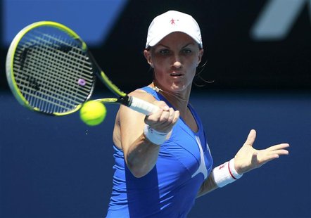 Svetlana Kuznetsova of Russia hits a return to Caroline Wozniacki of Denmark during their women's singles match at the Australian Open tenni Svetlana Kuznetsova of Russia hits a return to Caroline Wozniacki of Denmark during their women's singles match at the Australian Open tenni