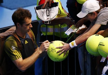 Andy Murray of Britain signs autographs for fans after defeating Gilles Simon of France in their men's singles match at the Australian Open Andy Murray of Britain signs autographs for fans after defeating Gilles Simon of France in their men's singles match at the Australian Open
