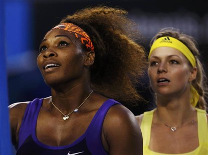 Serena Williams of the U.S. and Maria Kirilenko of Russia (R) shake hands with the chair umpire after their women's singles match at the Aus Serena Williams of the U.S. and Maria Kirilenko of Russia (R) shake hands with the chair umpire after their women's singles match at the Aus