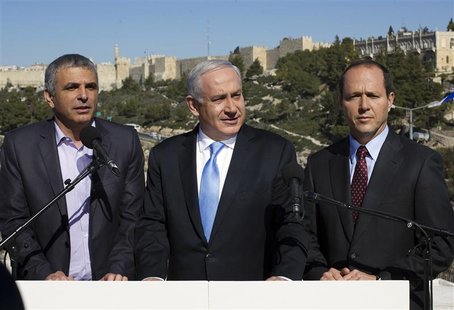 Israel's Prime Minister Benjamin Netanyahu (C) stands with Jerusalem Mayor Nir Barkat (R) and Communications Minister Moshe Kahlon outside t Israel's Prime Minister Benjamin Netanyahu (C) stands with Jerusalem Mayor Nir Barkat (R) and Communications Minister Moshe Kahlon outside t