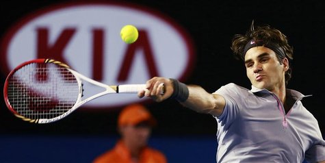 Roger Federer of Switzerland hits a return to Milos Raonic of Canada during their men's singles match at the Australian Open tennis tourname Roger Federer of Switzerland hits a return to Milos Raonic of Canada during their men's singles match at the Australian Open tennis tourname