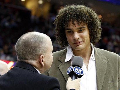 Cleveland Cavaliers Anderson Varejao talks with a TV reporter during the second quarter of the team's NBA basketball game against the Detroi Cleveland Cavaliers Anderson Varejao talks with a TV reporter during the second quarter of the team's NBA basketball game against the Detroi
