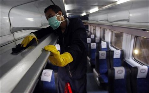 A worker uses disinfectant to clean the interior of a train in a Cairo trainyard, June 15, 2009. REUTERS/Amr Abdallah Dalsh A worker uses disinfectant to clean the interior of a train in a Cairo trainyard, June 15, 2009. REUTERS/Amr Abdallah Dalsh