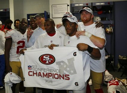 Members of the San Francisco 49ers pose in locker room with NFC championship banner after they defeated the Atlanta Falcons in the NFL NFC C Members of the San Francisco 49ers pose in locker room with NFC championship banner after they defeated the Atlanta Falcons in the NFL NFC C