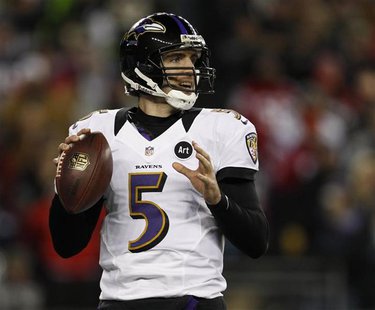 Baltimore Ravens quarterback Joe Flacco looks to pass against the New England Patriots during the NFL AFC Championship football game in Foxb Baltimore Ravens quarterback Joe Flacco looks to pass against the New England Patriots during the NFL AFC Championship football game in Foxb