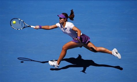 Li Na of China hits a return to Agnieszka Radwanska of Poland during their women's singles quarter-final match at the Australian Open tennis Li Na of China hits a return to Agnieszka Radwanska of Poland during their women's singles quarter-final match at the Australian Open tennis