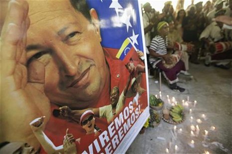 A poster of Venezuela's President Hugo Chavez is seen during a Afro-Cuban Santeria ceremony to pray for his recovery, in Havana January 10, A poster of Venezuela's President Hugo Chavez is seen during a Afro-Cuban Santeria ceremony to pray for his recovery, in Havana January 10,