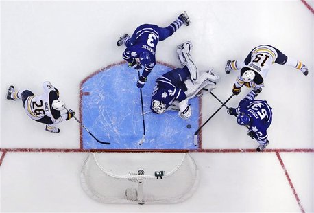 Toronto Maple Leafs goalie Ben Scrivens (30) makes a save on Buffalo Sabres' Cody Hodgson (19) during the third period of their NHL hockey g Toronto Maple Leafs goalie Ben Scrivens (30) makes a save on Buffalo Sabres' Cody Hodgson (19) during the third period of their NHL hockey g