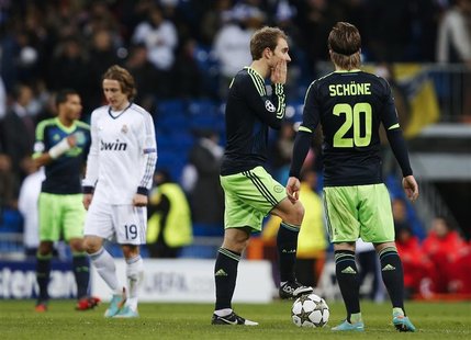 Ajax Amsterdam's Christian Eriksen (L) and Lasse Schone after Real Madrid's fourth goal during their Champions League Group D soccer match a Ajax Amsterdam's Christian Eriksen (L) and Lasse Schone after Real Madrid's fourth goal during their Champions League Group D soccer match a